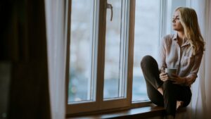 Reflective woman representing emotional processing and nervous system regulation