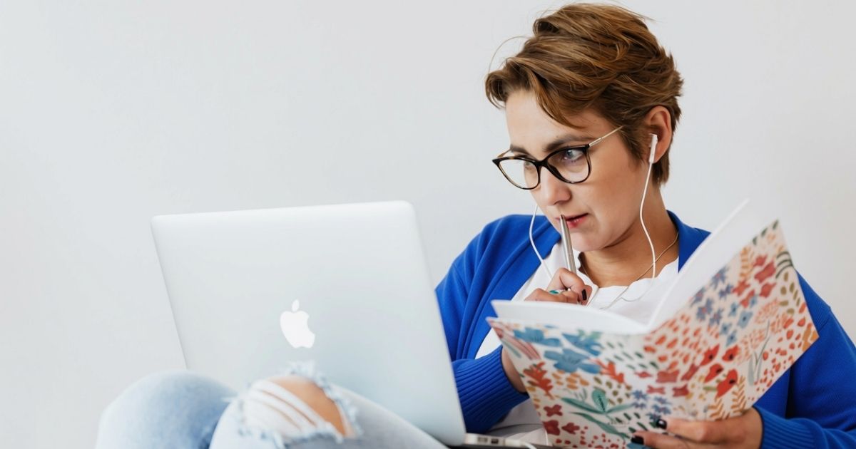 Woman completing a self-paced online stress management programme at home
